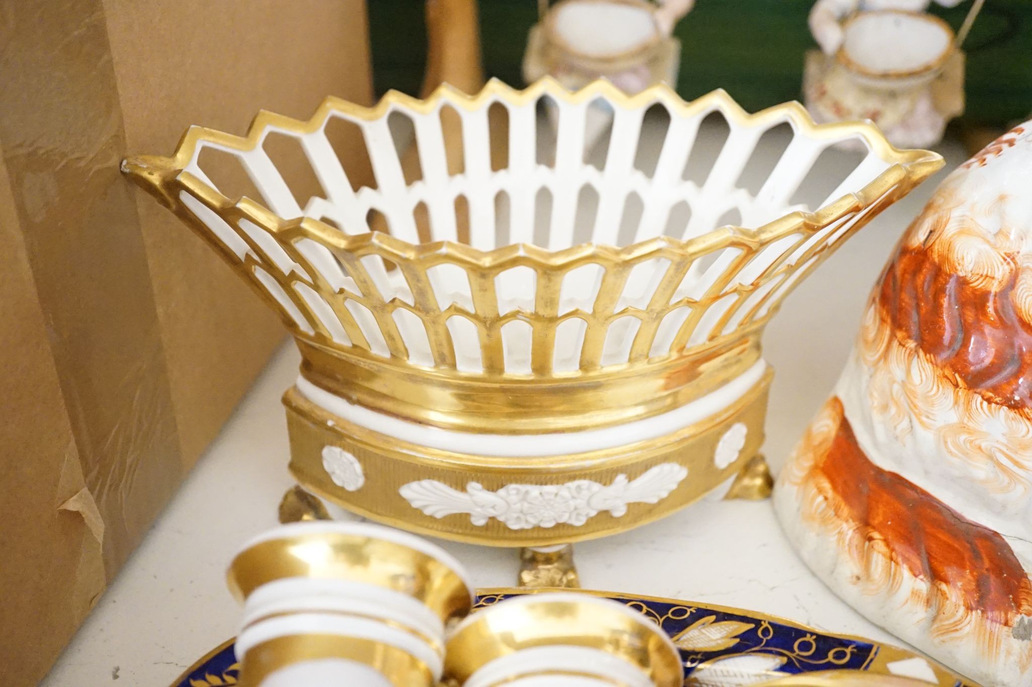 A pair of bisque swinging figures, Royal Worcester cabinet cup and saucer and five other items